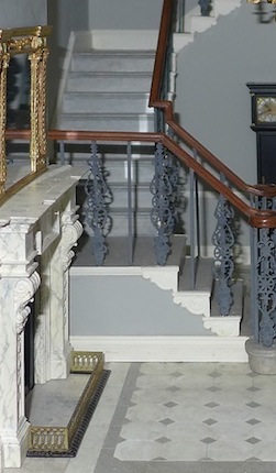 Ann Barringtons stately hallway has ceiling panels, stair fuurnture, doorcases and more